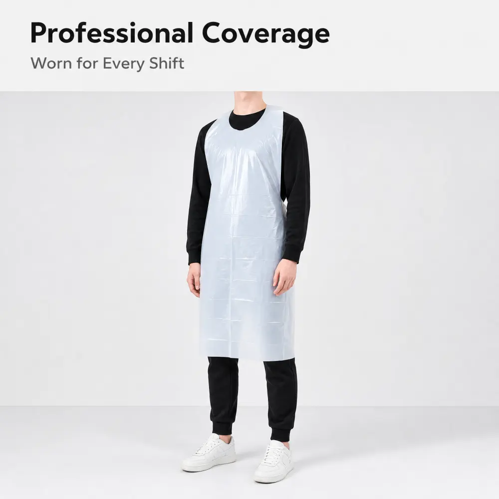 Person wearing the white PE apron over dark clothing in a work setting